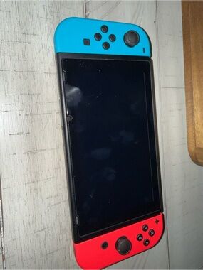 Nintendo Switch with Neon Blue (left) & Neon Red (right) Joy‑Con